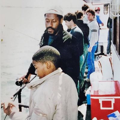 Both are on a boat, fiishing. 